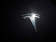 The Tesla logo on a car in Los Angeles, California.