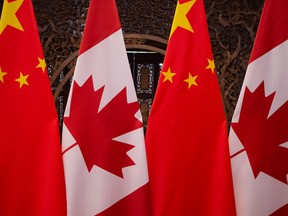 Canadian and Chinese flags in Beijing.