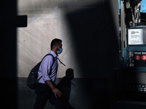 A person walks in the Financial District in Manhattan on Oct. 1, 2020 in New York City.