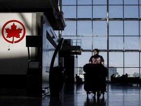 A passenger wheels his luggage at Toronto Pearson International Airport. Moody's said it expects Greater Toronto Airports Authority's passenger traffic this year to fall by around 75 per cent compared to last year, and that passenger volumes are unlikely return to 2019 levels before 2024.