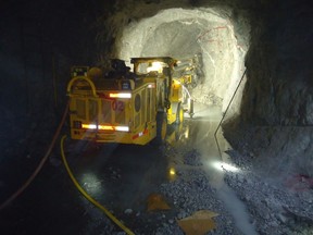 Photo 1: Jumbo in operation underground at Cusi Mine