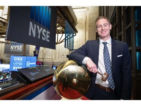 Kurt MacAlpine, CEO of CI Financial celebrates listing the company's common shares on the NYSE.