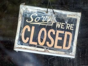 A closed sign on a Toronto store's front door during the COVID 19 pandemic.