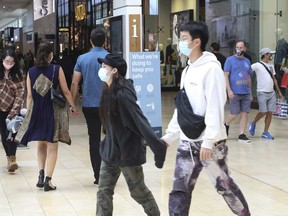 Shoppers wear masks in Toronto's Yorkdale mall in September.