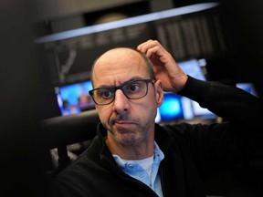 A stock trader looks at his monitors on Nov. 4.