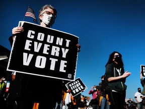 People participate in a protest in support of counting all votes as the election in Pennsylvania is still unresolved on Nov. 4, 2020 in Philadelphia, Pennsylvania.