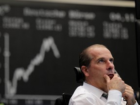 A stock trader looks at his monitors as the German share price index DAX reacts to the U.S. 2020 presidential election at the stock exchange in Frankfurt, Germany, November 4, 2020.