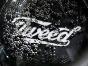 ubbles in a sample beverage over a Tweed logo seen during a tour at a Canopy Growth facility in Smiths Falls, Ont.