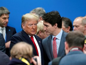 U.S. President Donald Trump talks with Canada's Prime Minister Justin Trudeau during a North Atlantic Treaty Organization Plenary Session at the NATO summit in Watford, in London, Britain, December 4, 2019.