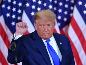 U.S. President Donald Trump pumps his fist after speaking during election night in the East Room of the White House in Washington, D.C., early on Nov. 4, 2020.