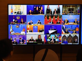 Representatives of signatory countries are pictured on screen during the signing ceremony for the Regional Comprehensive Economic Partnership (RCEP) trade pact at the ASEAN summit that is being held online in Hanoi, on Nov. 15, 2020.