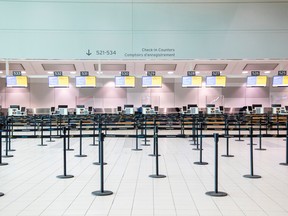 An empty check-in counter at Toronto Pearson International Airport.