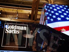 he Goldman Sachs logo is displayed on a post above the floor of the New York Stock Exchange.