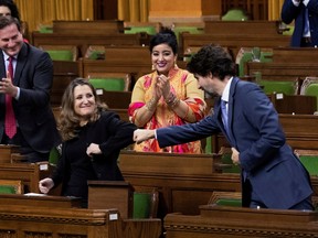 Finance Minister Chrystia Freeland receives a fist-bump from Prime Minister Justin Trudeau after unveiling her first fiscal update, the Fall Economic Statement 2020, on Monday.