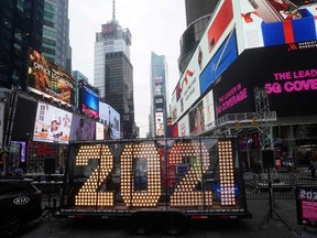 New York City's Times Square prepares for New Year's celebrations. The Economist believes the 2020s will be like the Roaring 1920s, which were “a ferment of forward-looking, risk-taking social, industrial and artistic novelty.”