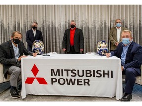 Jim Heilbron (L), Alabama Power's Senior Vice President and Senior Production Officer, and Paul Browning, Mitsubishi Power's President and CEO, mark the JAC selection with a Japanese signing tradition. (Credit: Mitsubishi Power)