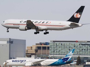 A Cargojet plane lands at the Calgary International Airport in March, 2020. The COVID-19 pandemic has shut down most passenger air traffic around the world, but the airport has seen an increase in cargo flights.