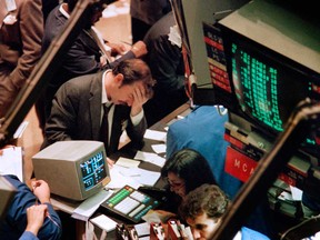 A trader on the New York Stock Exchange reacts on Oct. 19, 1987 as stocks are devastated during what was one of the most frantic days in the exchange's history.