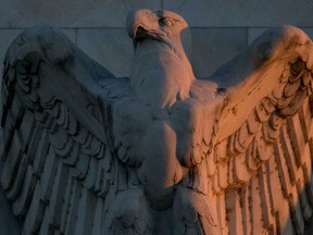 An eagle sculpture stands on the facade of the Marriner S. Eccles Federal Reserve building in Washington. After two major recessions in just over 10 years there is very little left in the monetary playbook.