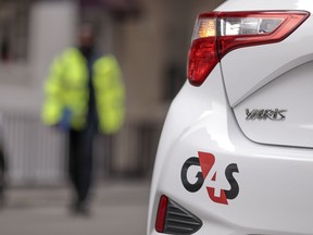 G4S Plc logo sits on an automobile outside one of the company's offices in London, U.K.
