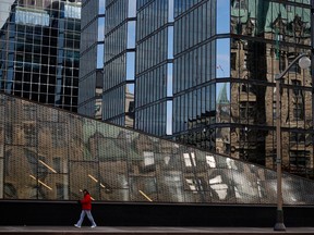 A pedestrian walks past the Bank of Canada building in Ottawa, in October.