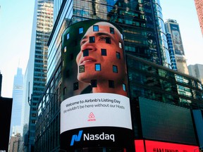 The Airbnb logo is displayed on the Nasdaq digital billboard in Times Square in New York on Dec. 10, 2020.