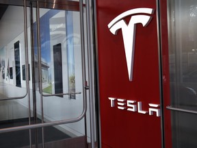Is Tesla an automaker? Or is it a technology company? Or is it some sort of an amalgamation of both?