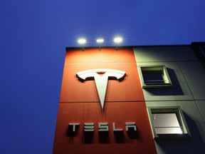 A logo of car manufacturer Tesla is seen at a branch office in Bern, Switzerland.