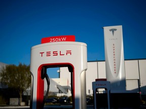 A Tesla logo is seen on a 250kW electric vehicle charging station at the Tesla Inc. supercharger station on January 4, 2021 in Hawthorne, California.