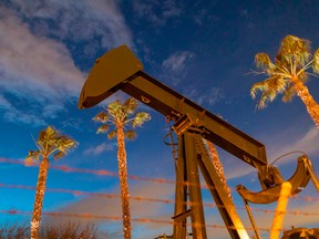 Pumpjacks draw crude oil from the Long Beach Oil Field under Discovery Well Park in Signal Hill, California.