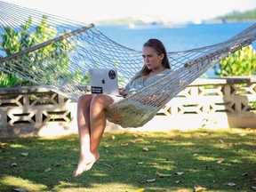 A woman works remotely from Bermuda in November.