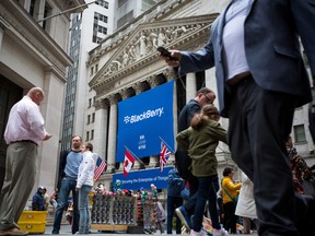 BlackBerry Ltd. signage is displayed in front of the New York Stock Exchange (NYSE) during the company's listing migration to the NYSE in New York, U.S., on Monday, Oct. 16, 2017.