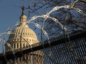 Concertina razor wire tops the eight-foot 'non-scalable' fence that surrounds the U.S. Capitol. Thousands of National Guard troops have been activated to protect the nation's capital against threats surrounding President-elect Joe Biden’s inauguration and to prevent a repeat of the deadly insurrection at the U.S. Capitol.