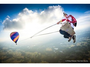 Austrian photographer Philip Platzer gets the perfect in-air shot of Red Bull Skydive teammate, Marco Fürst, participating in The Megaswing Project.