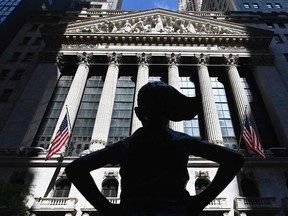 The "Fearless Girl" statue stands in front of the New York Stock Exchange at Wall Street in New York City.