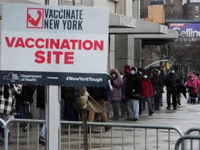 People line up outside Yankee stadium for vaccines amid the coronavirus disease pandemic in the Bronx borough of New York City in February, 2021. Data show Canada had administered only 3.72 doses per 100 people as of Feb. 19, whereas U.S. deployment as of Feb. 21 was 18.86 doses per 100 people.