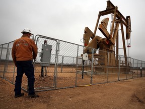 An oil well owned an operated by Apache Corporation in the Permian Basin in 2015 in Garden City, Texas.