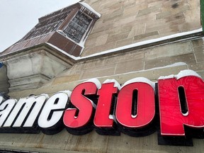 Snow settles on a GameStop sign in the Jackson Heights neighborhood of New York City, U.S. February 1, 2021.
