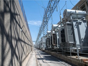 Rows of transformers sit behind the turbine facility at the Ontario Power Generation Inc. Sir Adam Beck Generating Station along the Niagara River in Niagara Falls, Ont.