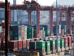 hipping containers are loaded onto rail cars at the Global Container Terminals Inc. (GCT) Vanterm container terminal on Vancouver Harbour in Vancouver, British Columbia, Canada, on Saturday, March 21, 2020.