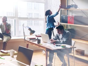 Young startup group working in modern office. Open space, laptop