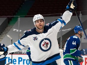 Adam Lowry of the Winnipeg Jets celebrates after scoring a goal against the Vancouver Canucks in NHL action in Vancouver. The NHL had previously opposed single-game sports betting in Canada.