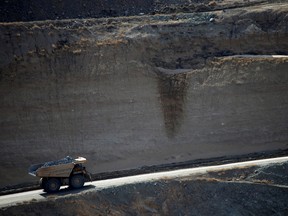 A mining truck takes ore from the open-mine pit at a rare earths mine in California.