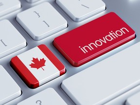 A Canadian flag and the word "innovation" on the keys of a computer keyboard.