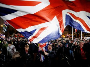 man waves a British flag on Brexit day in London, Britain January 31, 2020.