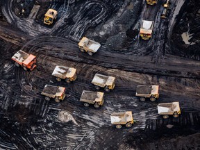 eavy haulers are seen at the Suncor Energy Inc. Fort Hills mine in this aerial photograph taken above the Athabasca oil sands near Fort McMurray.