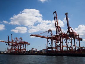 Gantry cranes stand at the Port of Vancouver in Vancouver.