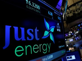 The company logo and trading information for Just Energy Group Inc. is displayed on a screen on the floor of the New York Stock Exchange (NYSE) in New York, U.S., March 30, 2017.