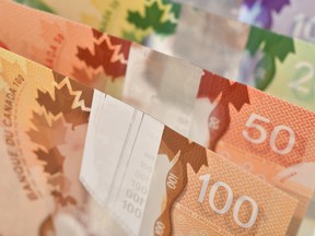 Closeup of Canadian banknotes, $100, $50, $20 and $10 bills.