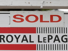 A Royal LePage real estate sign is marked ‘Sold’ in front of a house in Ottawa.